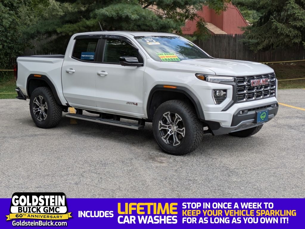 2024 GMC Canyon AT4 in Summit White — front three-quarter view
