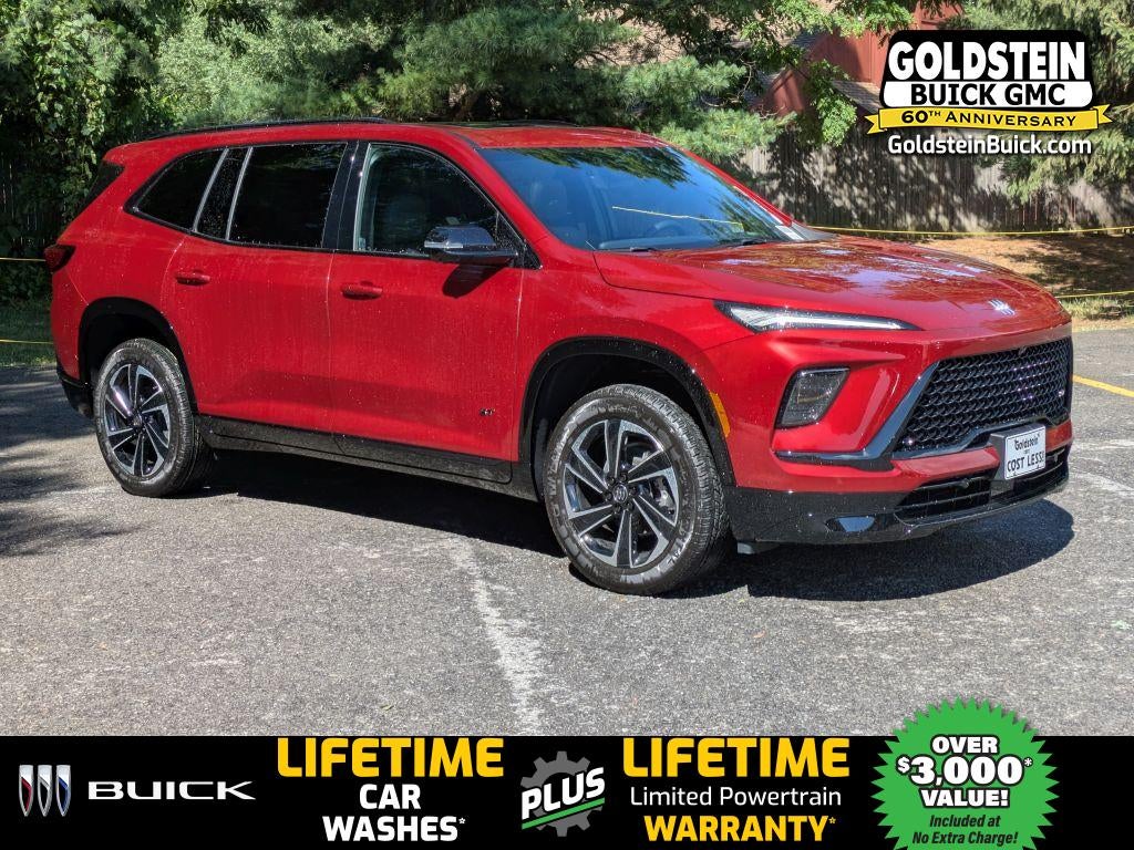 2026 Buick Enclave Sport Touring in Cherry Red Tintcoat — front three-quarter view