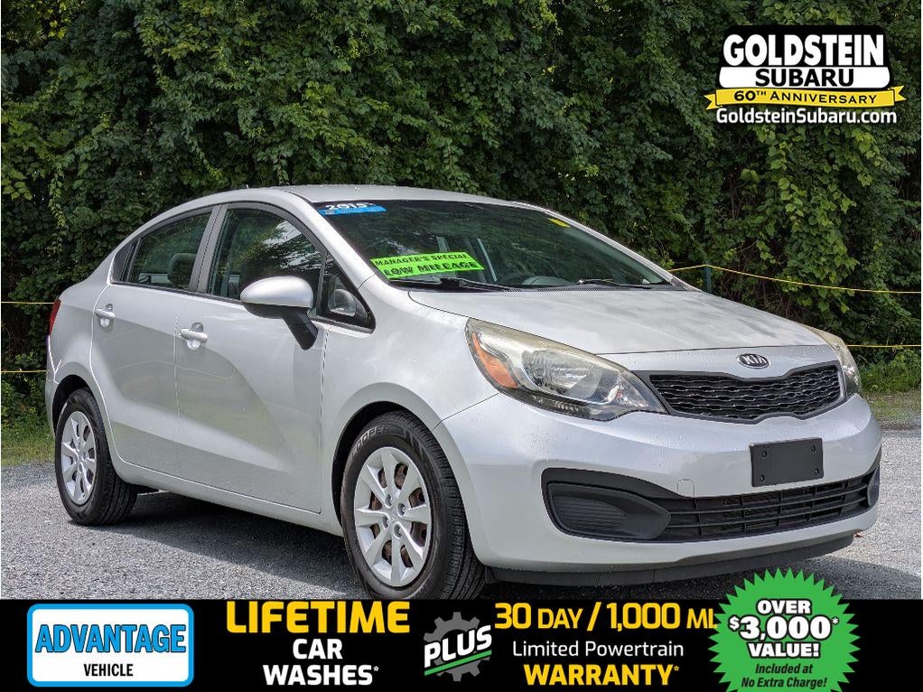 2015 Kia Rio LX in Bright Silver — front three-quarter view